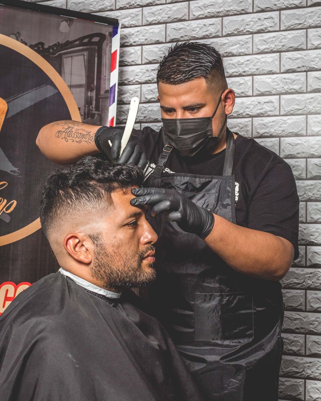 A barber mid-cut, focused on detail